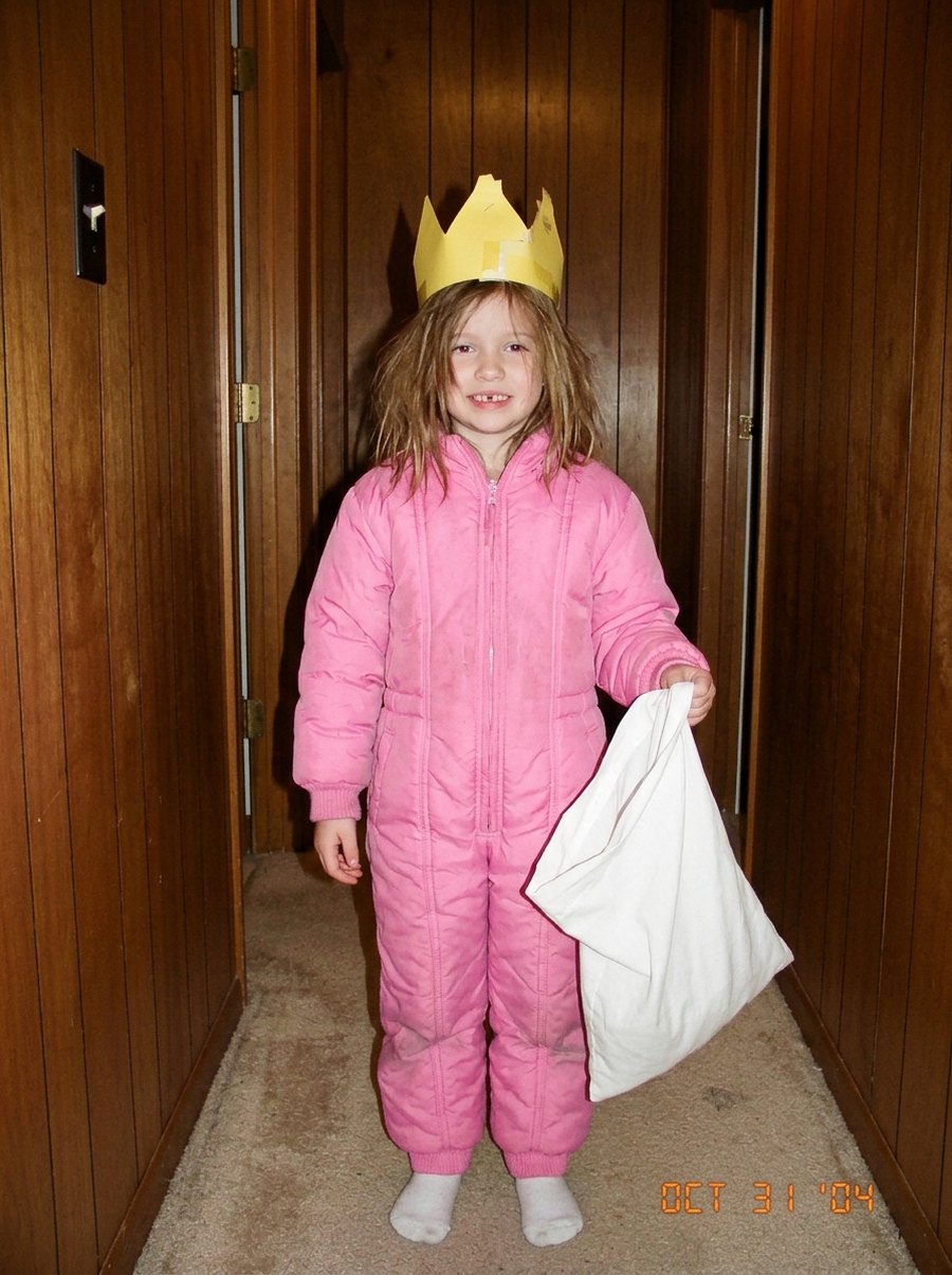 Slide 4: the real photo, a kid in a pink snowsuit and a paper crown
